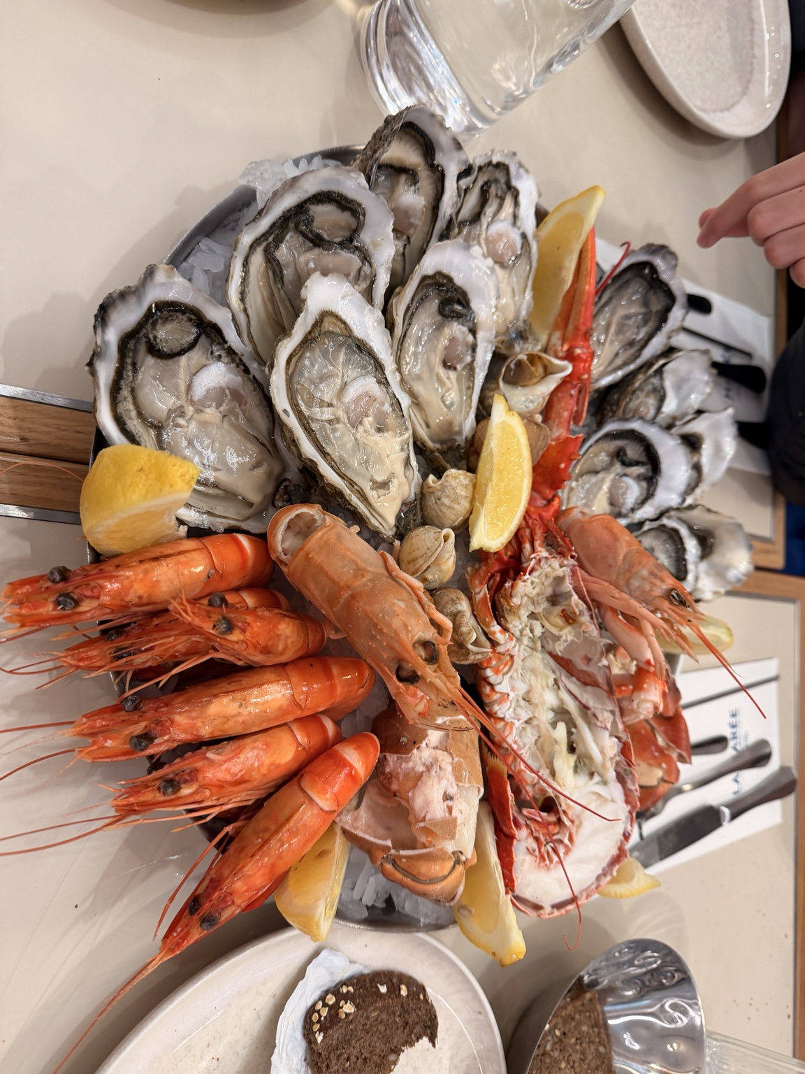 Seafood platter with oysters, prawns, lobster and lemon